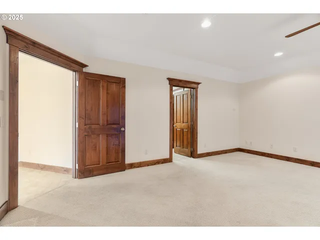 a view of an empty room and a window