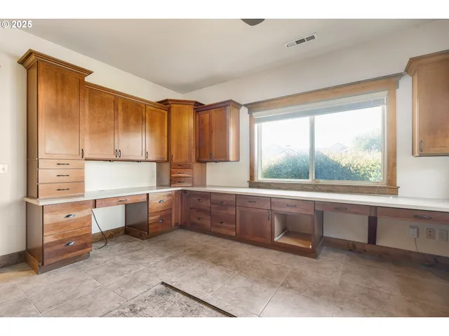 a kitchen with appliances cabinets and a sink