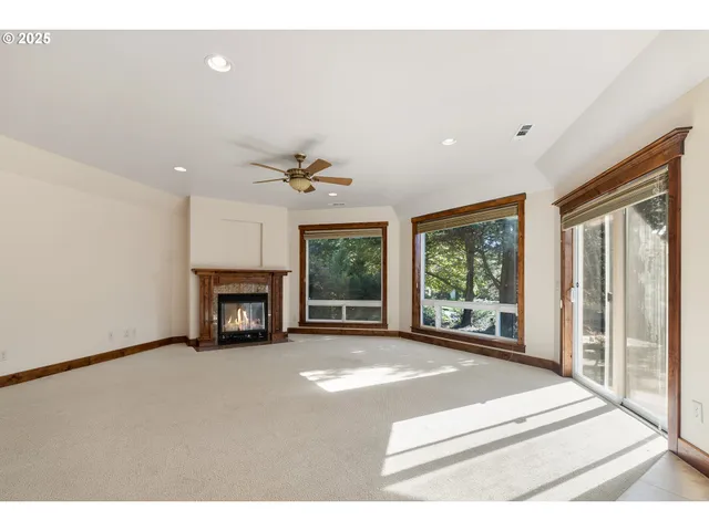 a spacious bedroom with a bed and a fireplace