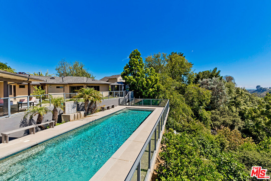 2205 Stradella Road Los Angeles, CA 90077 - Photo 30 of 53 a view of a house with a big yard