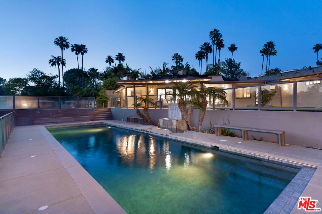 2205 Stradella Road Los Angeles, CA 90077 - Photo 3 of 53 a view of a swimming pool with an outdoor seating