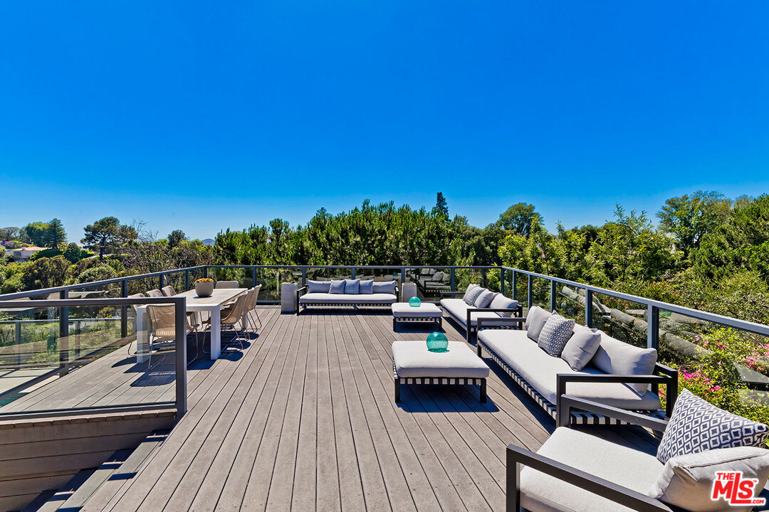 2205 Stradella Road Los Angeles, CA 90077 - Photo 31 of 53 a view of a balcony with chairs