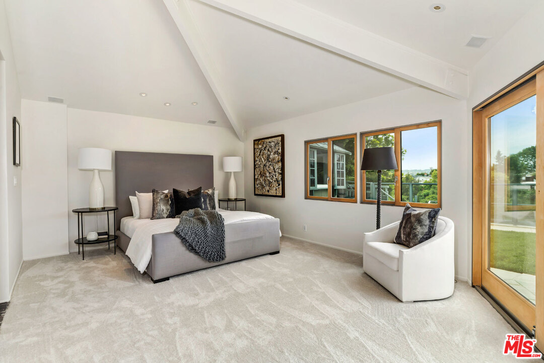 2205 Stradella Road Los Angeles, CA 90077 - Photo 34 of 53 a living room with furniture and a large window