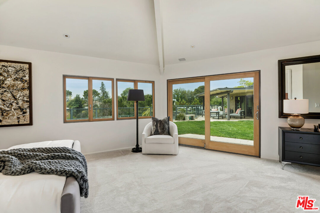 2205 Stradella Road Los Angeles, CA 90077 - Photo 35 of 53 a bedroom with furniture and large window