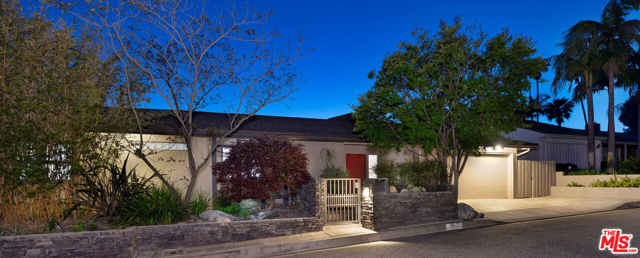 2205 Stradella Road Los Angeles, CA 90077 - Photo 4 of 53 a view of a house with street and trees