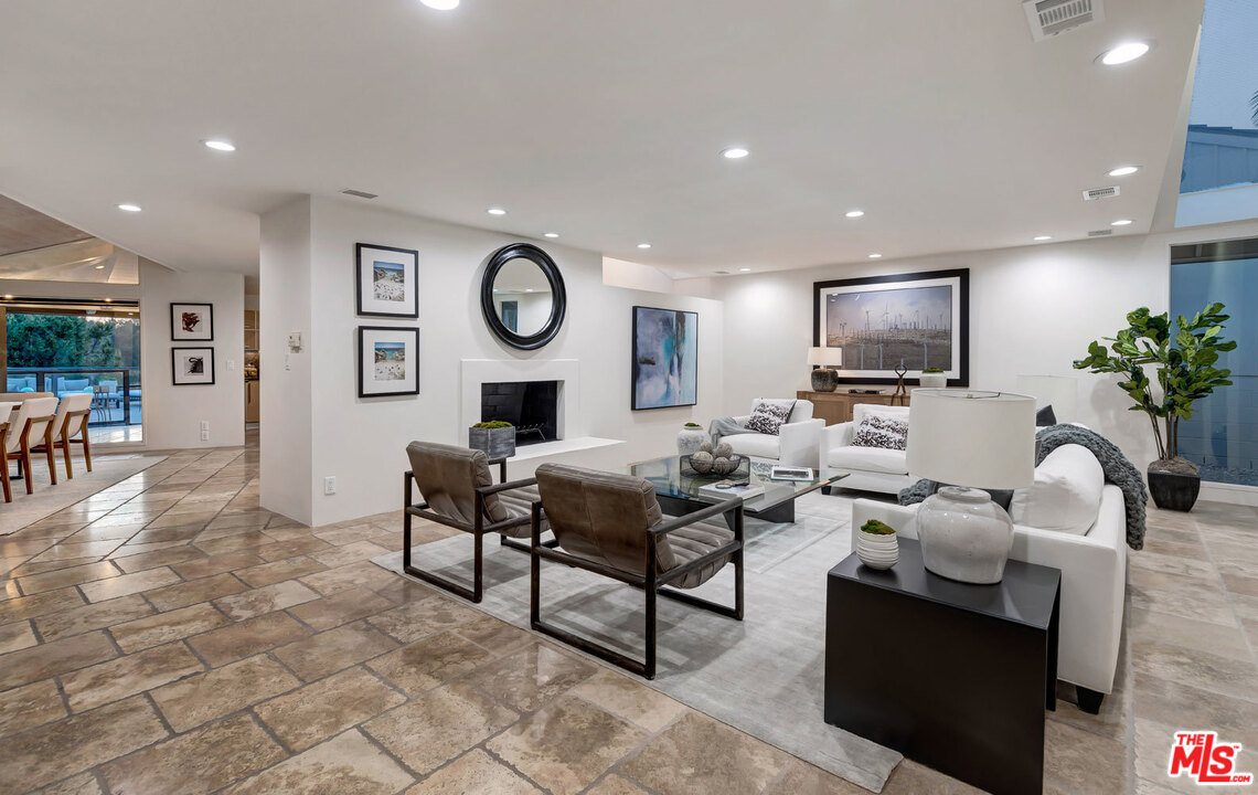 2205 Stradella Road Los Angeles, CA 90077 - Photo 45 of 53 a living room with furniture and a flat screen tv