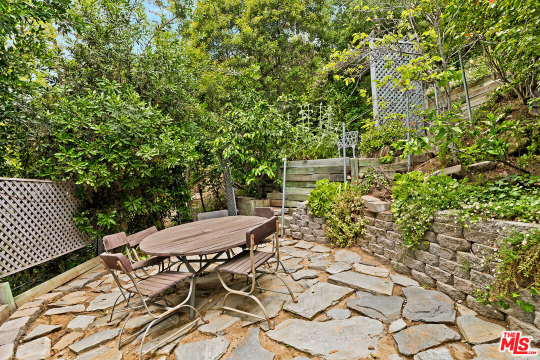 2205 Stradella Road Los Angeles, CA 90077 - Photo 49 of 53 a view of a chairs and table in the patio