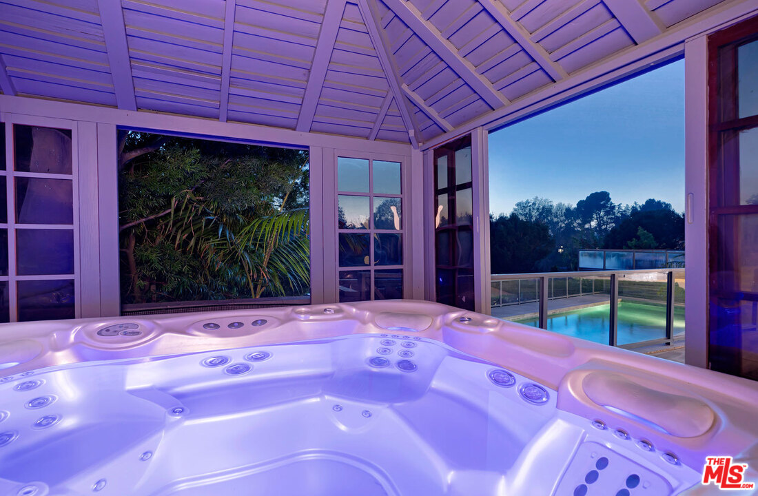 2205 Stradella Road Los Angeles, CA 90077 - Photo 52 of 53 a view of a backyard with wooden fence and a porch