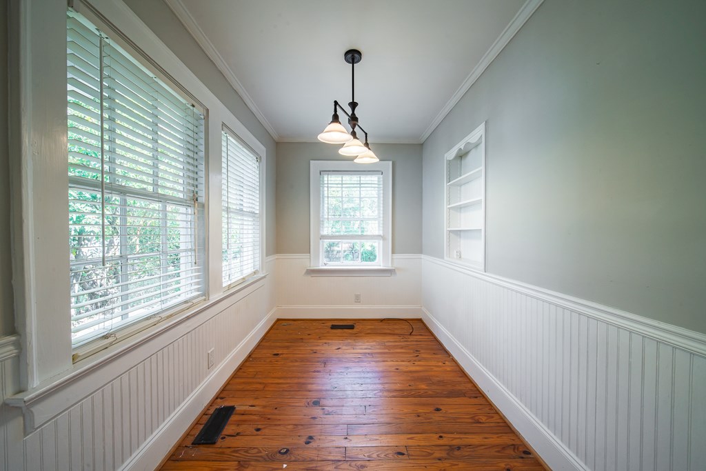 1705 Slade Drive Columbus, GA 31901 - Photo 14 of 37 a view of empty room with wooden floor and fan