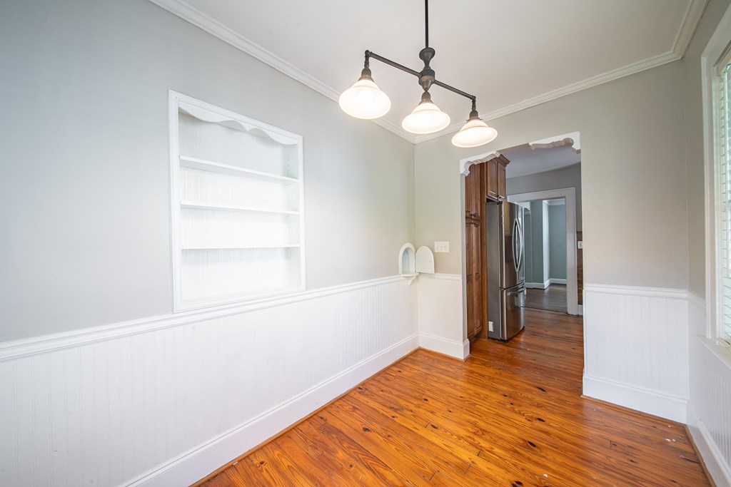1705 Slade Drive Columbus, GA 31901 - Photo 15 of 37 a view of an empty room with wooden floor and a window
