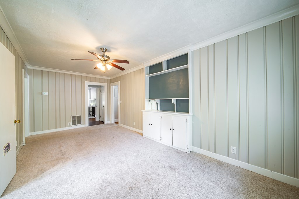 1705 Slade Drive Columbus, GA 31901 - Photo 17 of 37 a view of a livingroom with a ceiling fan and window