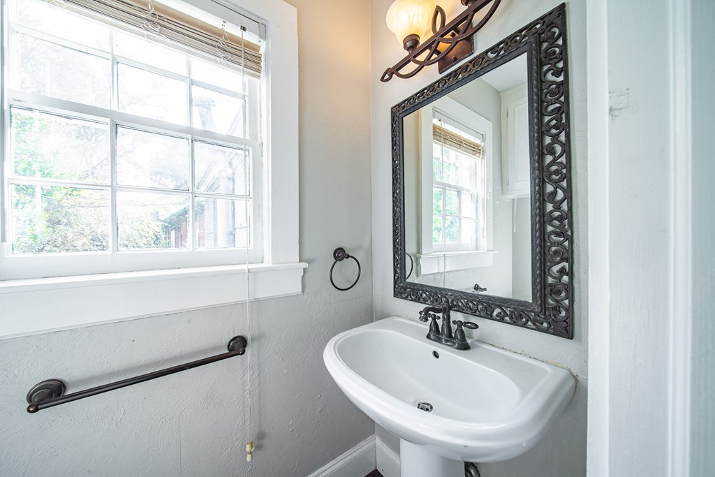 1705 Slade Drive Columbus, GA 31901 - Photo 19 of 37 a bathroom with a sink and a window