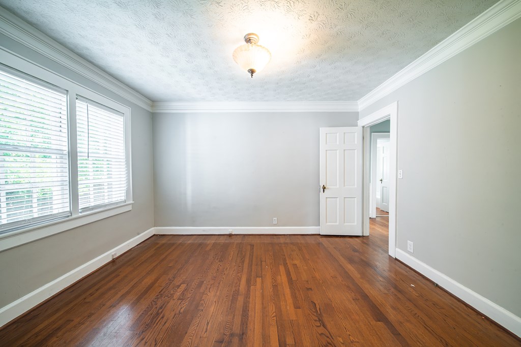 1705 Slade Drive Columbus, GA 31901 - Photo 20 of 37 an empty room with wooden floor and windows