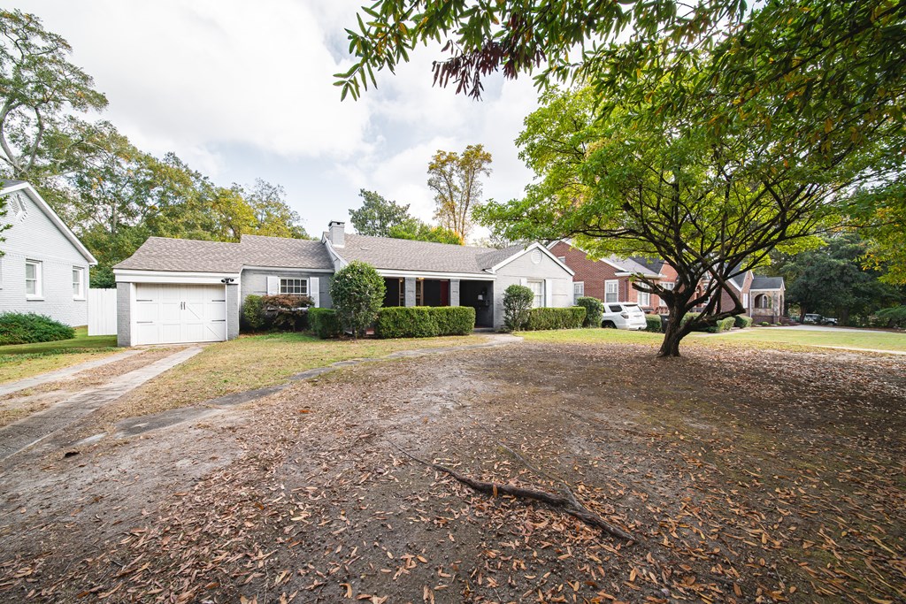 1705 Slade Drive Columbus, GA 31901 - Photo 2 of 37 a front view of a house with a yard and garage