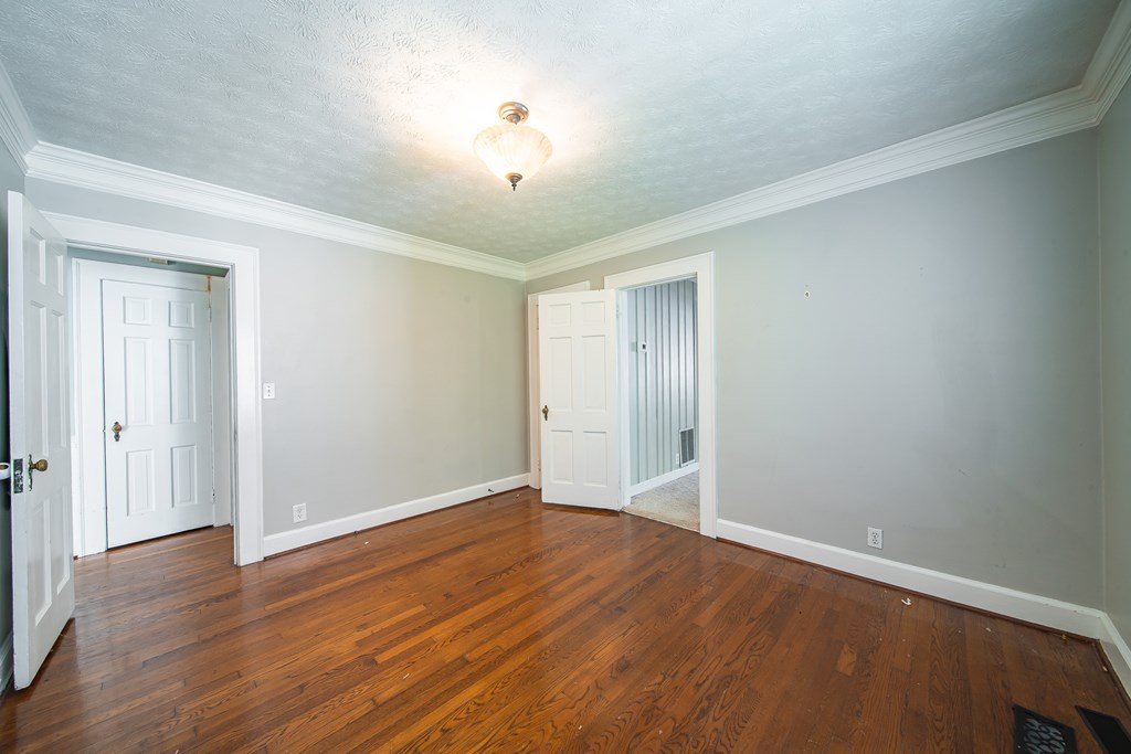 1705 Slade Drive Columbus, GA 31901 - Photo 21 of 37 a view of an empty room with wooden floor