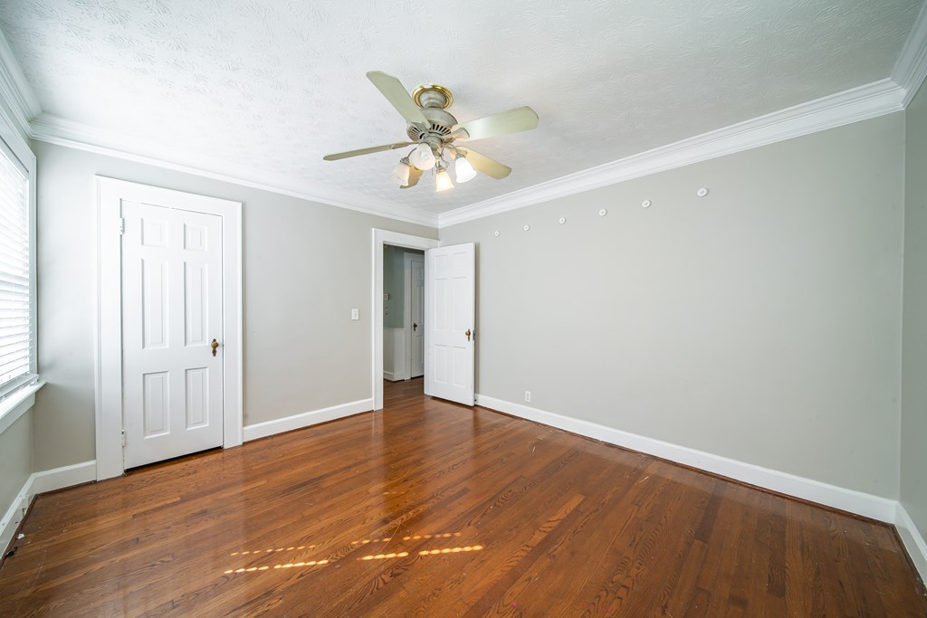 1705 Slade Drive Columbus, GA 31901 - Photo 23 of 37 a view of an empty room with window and wooden floor