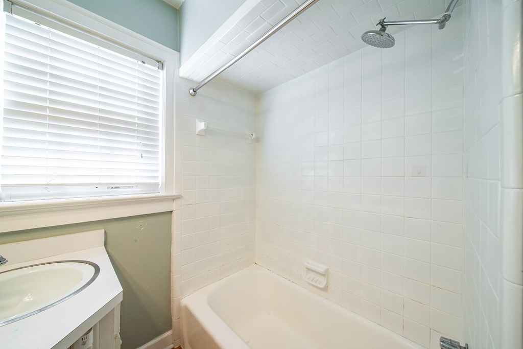 1705 Slade Drive Columbus, GA 31901 - Photo 26 of 37 a bathroom with a sink a toilet and a bathtub
