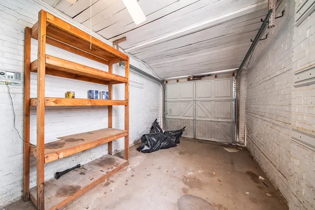 a view of a room with rack on the wall and a window