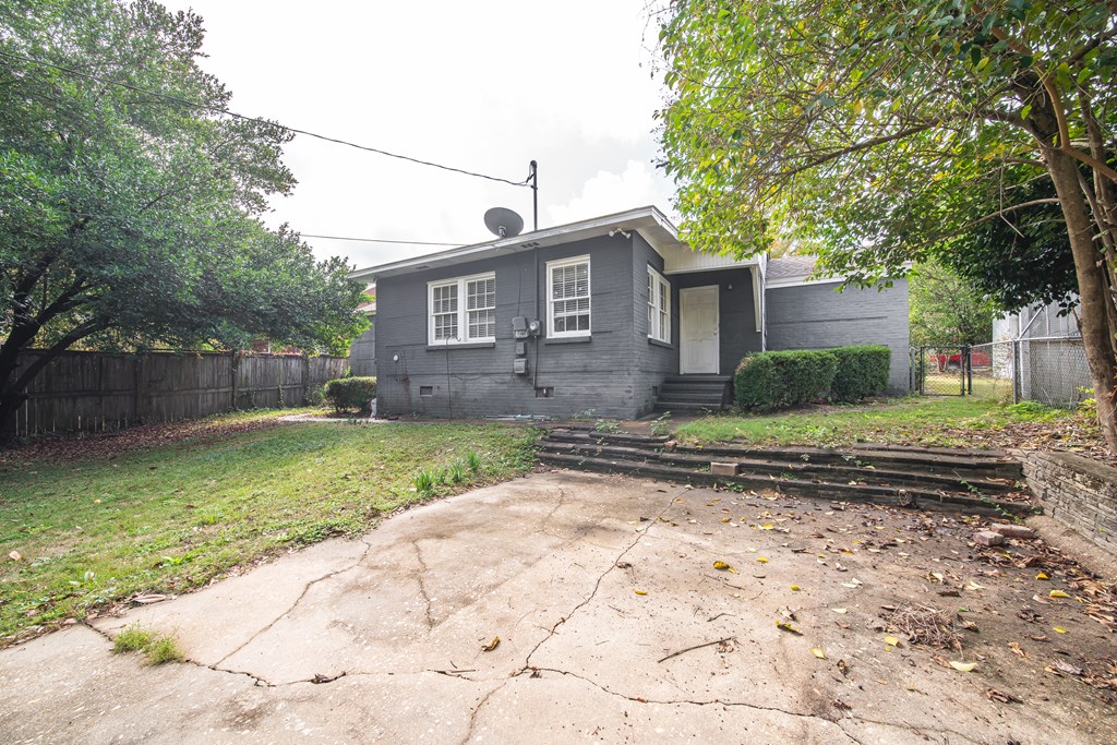 1705 Slade Drive Columbus, GA 31901 - Photo 34 of 37 a view of a brick house with a yard