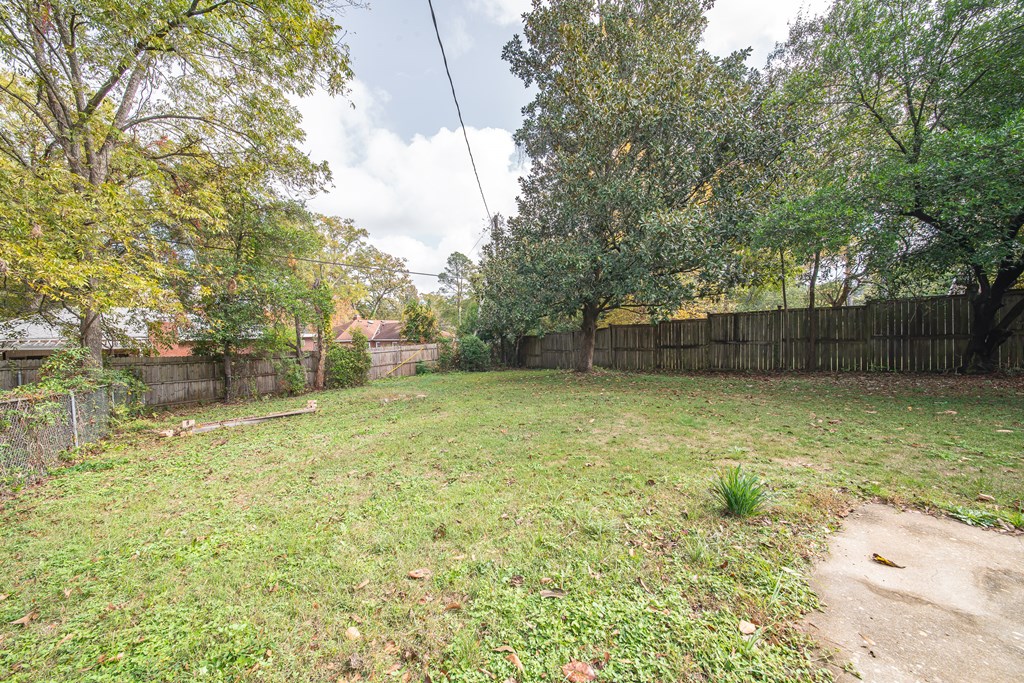 1705 Slade Drive Columbus, GA 31901 - Photo 36 of 37 a backyard of a house with lots of green space