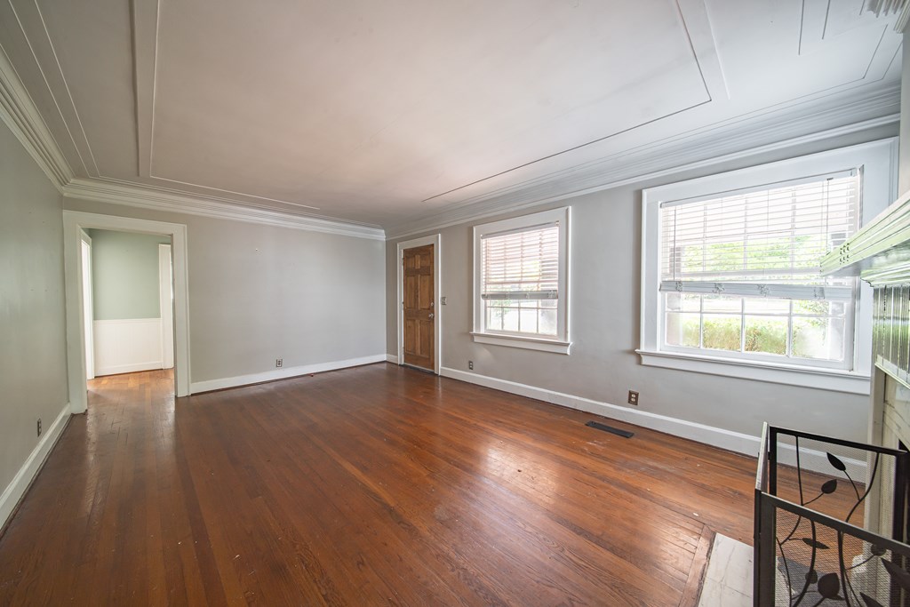 1705 Slade Drive Columbus, GA 31901 - Photo 7 of 37 an empty room with wooden floor and windows