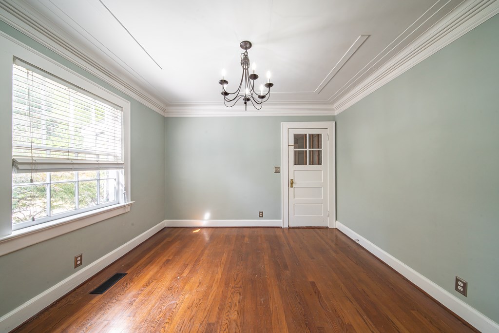 1705 Slade Drive Columbus, GA 31901 - Photo 8 of 37 wooden floor in an empty room with a window