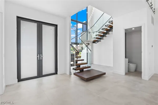 a bathroom with a double vanity sink mirror and shower