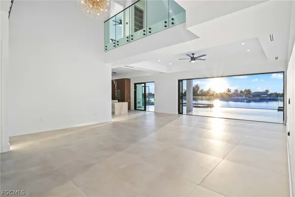 a white toilet sitting next to a white wall