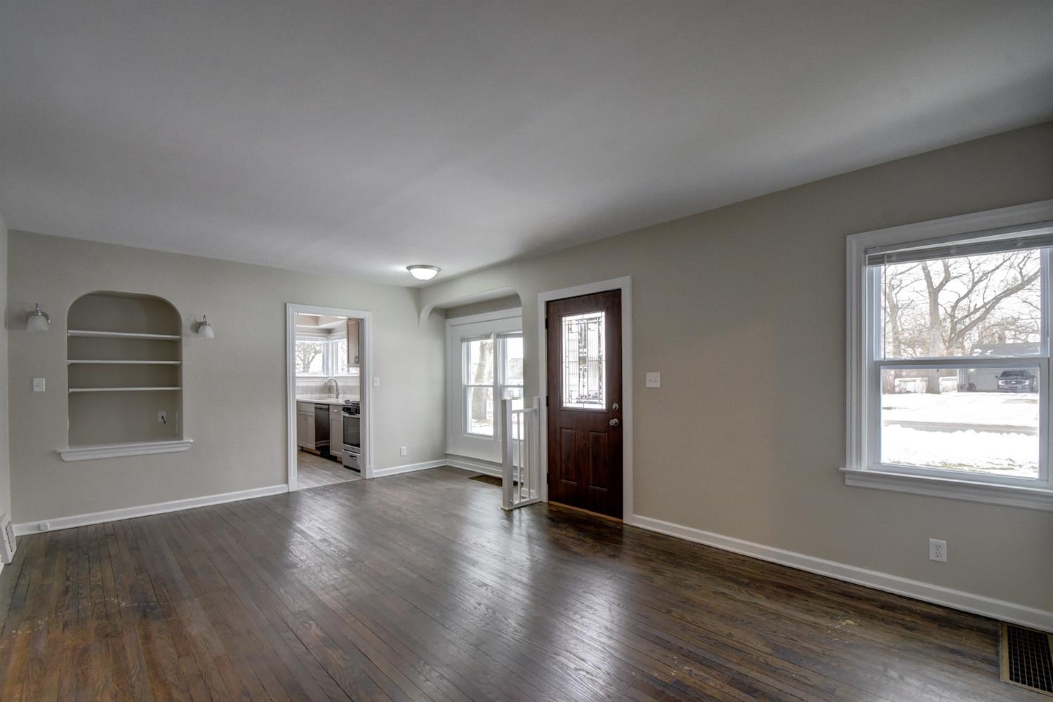 2100 Ranburn Drive Gary, IN 46408 - Photo 11 of 23 a view of an empty room with a window and wooden floor