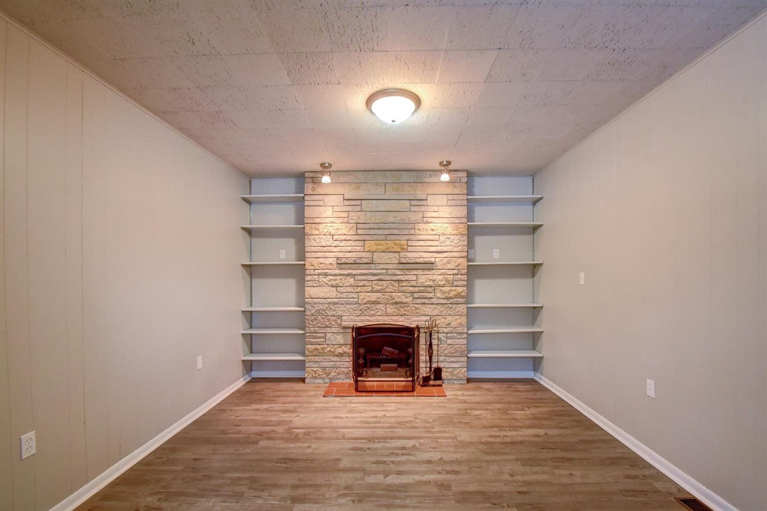 2100 Ranburn Drive Gary, IN 46408 - Photo 12 of 23 a view of an empty room with a fireplace and a window
