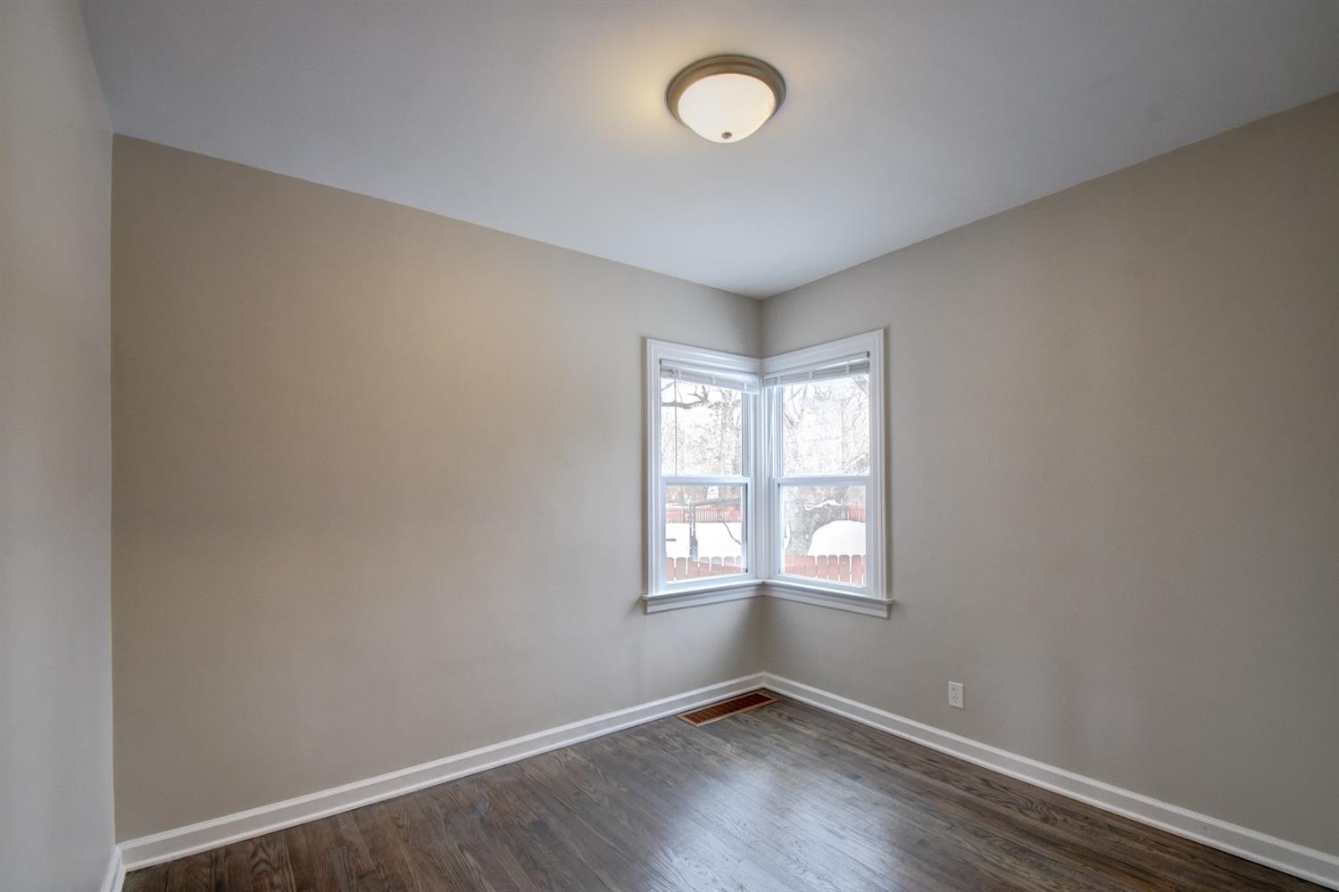 2100 Ranburn Drive Gary, IN 46408 - Photo 14 of 23 an empty room with wooden floor and windows