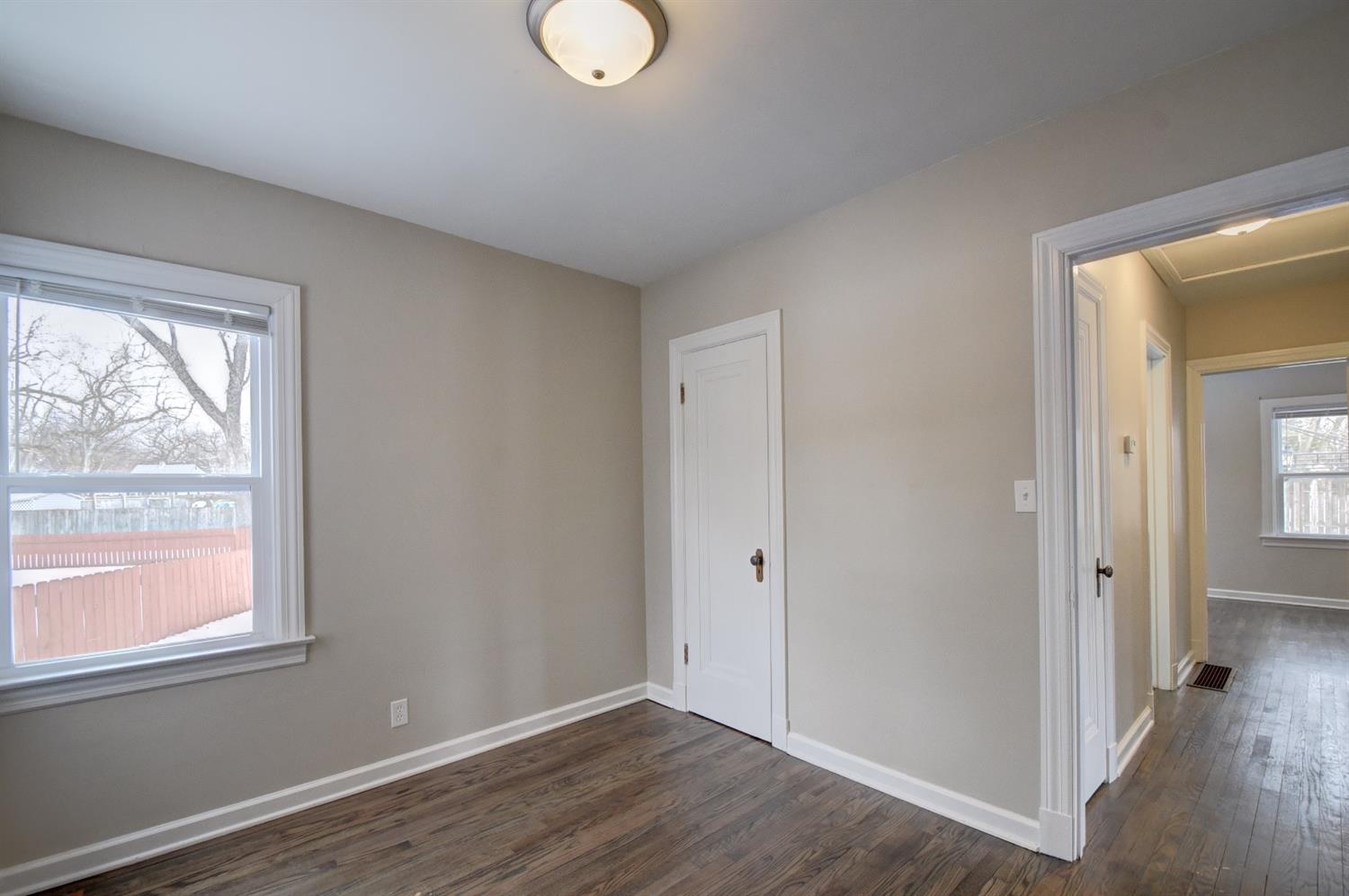 2100 Ranburn Drive Gary, IN 46408 - Photo 15 of 23 a view of an empty room with wooden floor and a window