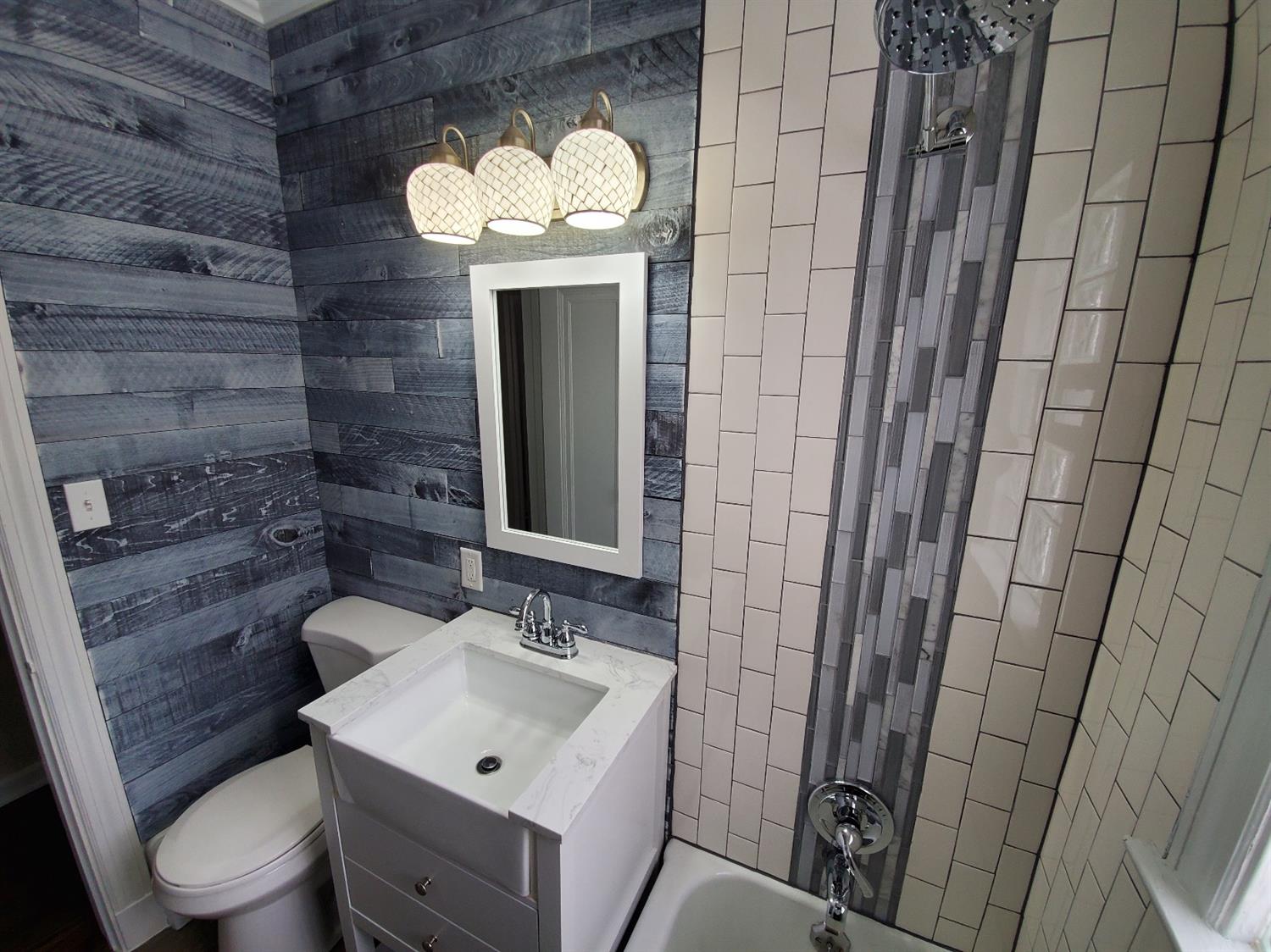 2100 Ranburn Drive Gary, IN 46408 - Photo 19 of 23 a bathroom with a sink a toilet and mirror