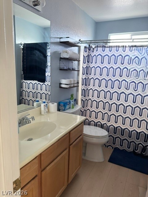 5171 Piazza Cavour Drive Las Vegas, NV 89156 - Photo 9 of 13 A compact bath featuring a single vanity and a shower-tub combination with privacy curtain.