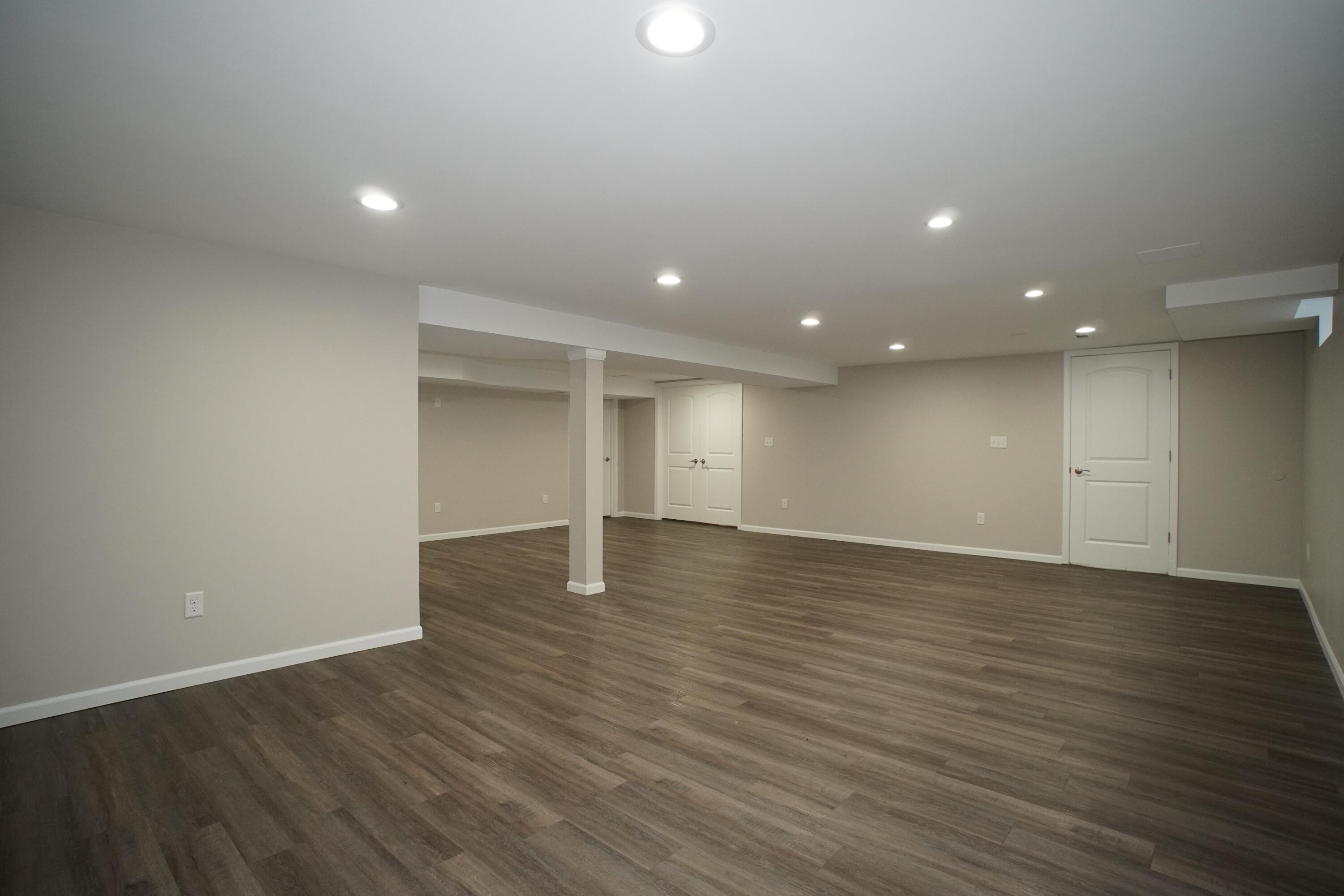 6092 Cleveland Street Merrillville, IN 46410 - Photo 22 of 32 an empty room with wooden floor and natural light