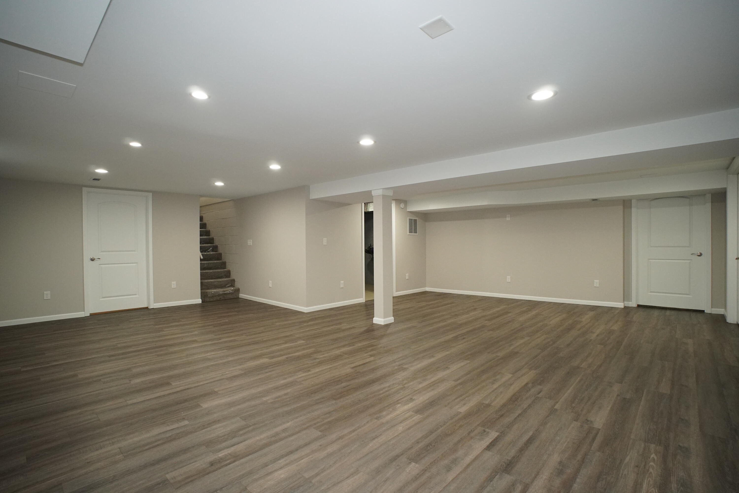 6092 Cleveland Street Merrillville, IN 46410 - Photo 23 of 32 an empty room with wooden floor and windows