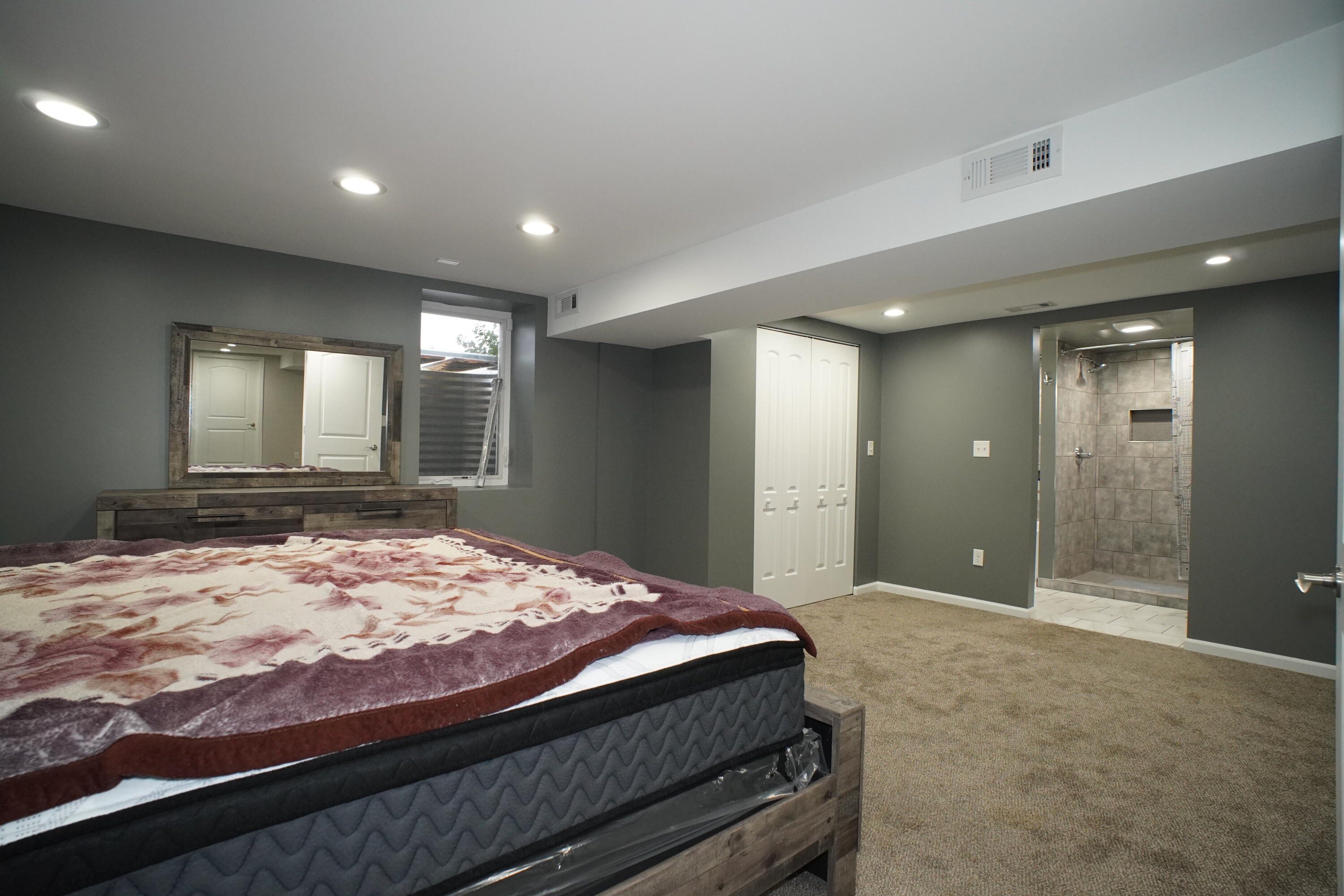 6092 Cleveland Street Merrillville, IN 46410 - Photo 25 of 32 a bathroom with a sink and a large mirror