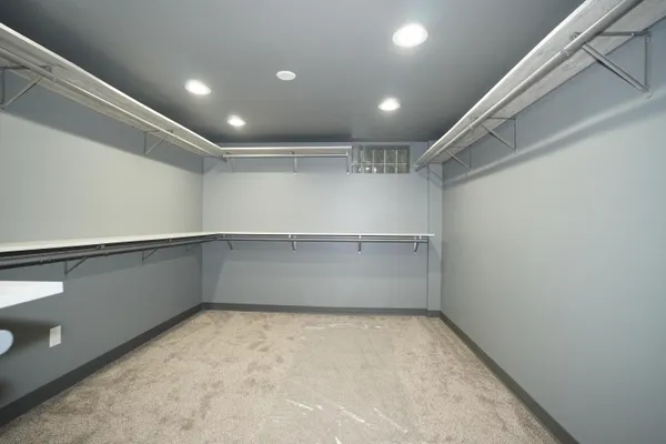 a bathroom with a sink mirror and shower