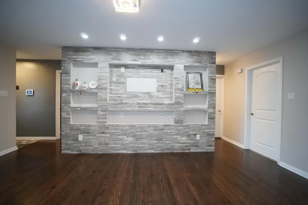 a view of kitchen cabinets and wooden floor