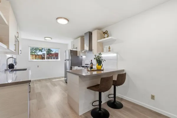 a workspace with furniture and wooden floor