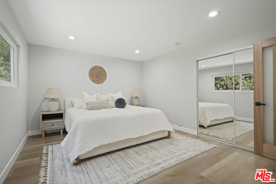 19009 Celtic Street Porter Ranch, CA 91326 - Photo 15 of 28 a bedroom with a bed and a chair