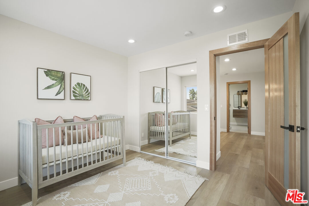 19009 Celtic Street Porter Ranch, CA 91326 - Photo 24 of 28 a view of a bedroom with wooden floor