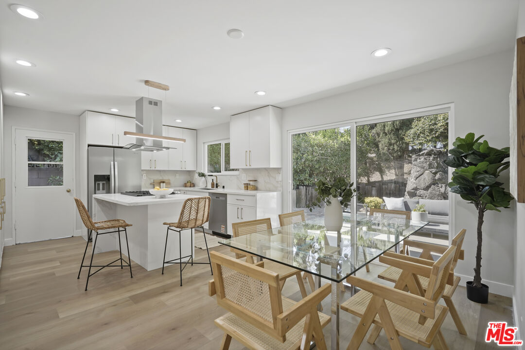 19009 Celtic Street Porter Ranch, CA 91326 - Photo 8 of 28 a view of a dining room with furniture window and outside view