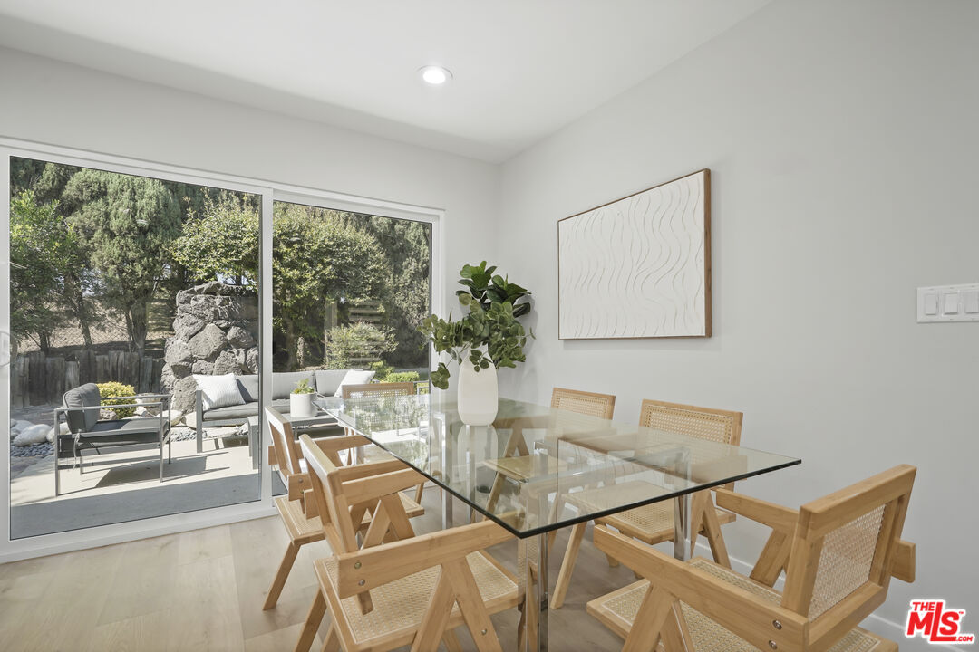 19009 Celtic Street Porter Ranch, CA 91326 - Photo 10 of 28 a dining room with furniture and large windows