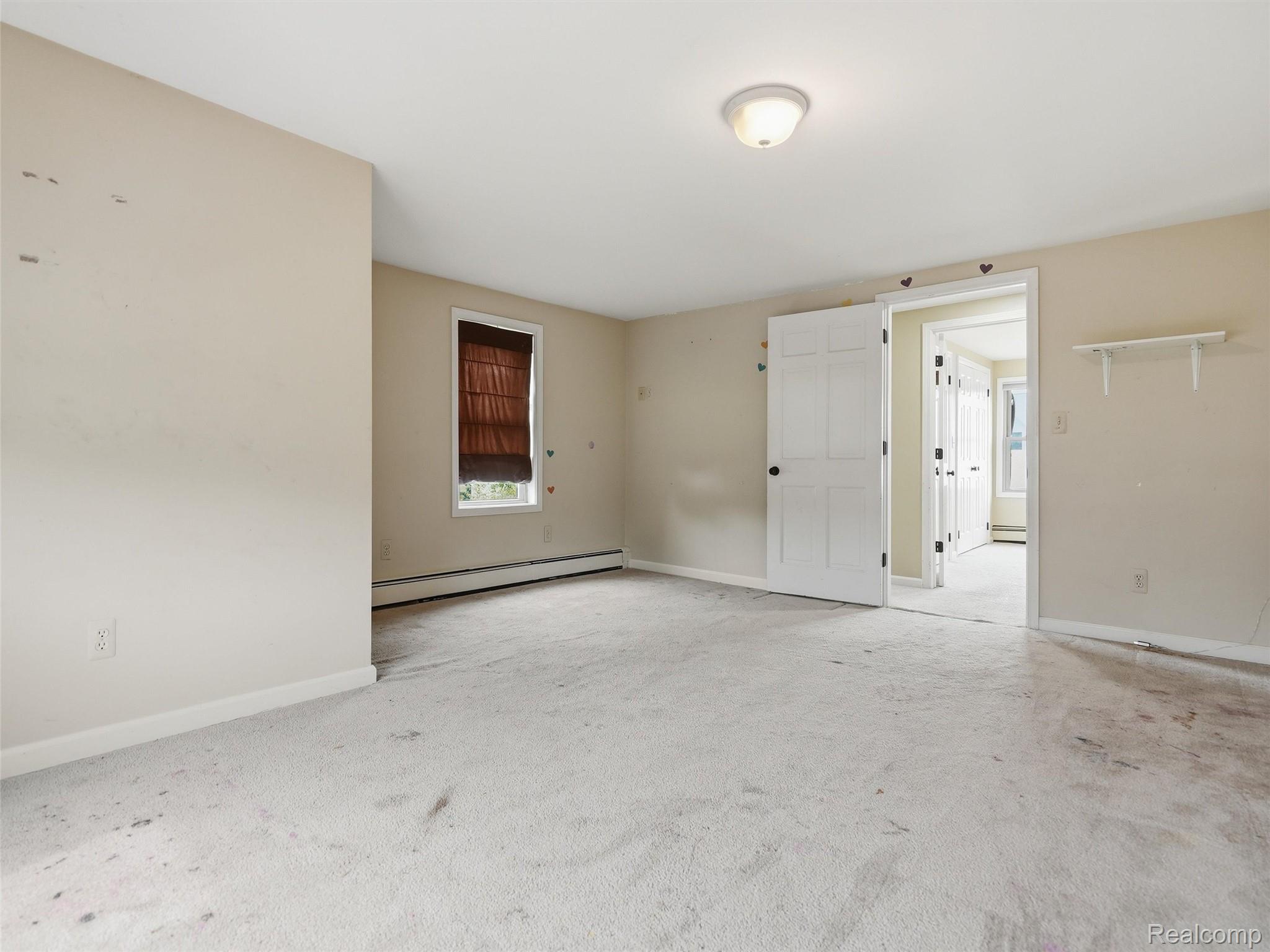 117 Kenyon Road Algonac, MI 48001 - Photo 29 of 47 Spacious room featuring carpeting, a single window with blinds, and neutral wall paint