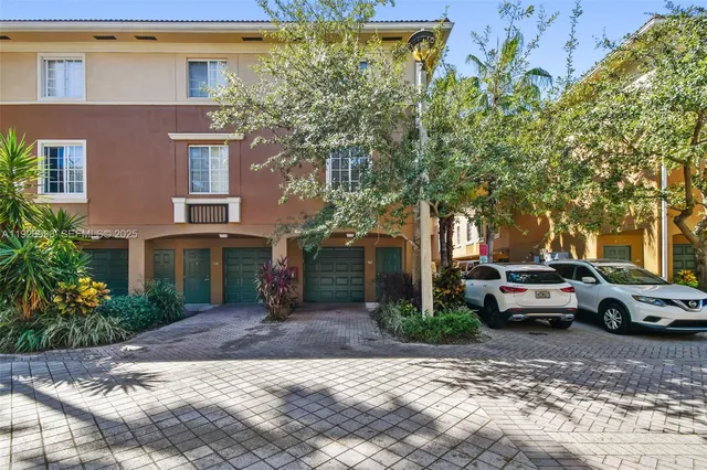 a view of a car park in front of a building