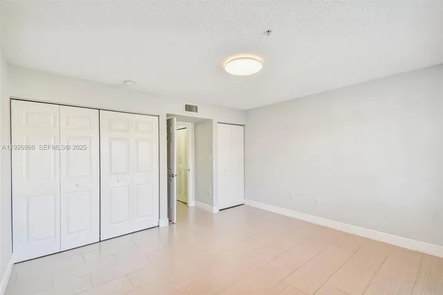 a view of bathroom with a washer and dryer