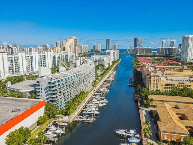 a view of swimming pool with outdoor seating and plants