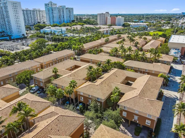 an aerial view of a house with a lake view