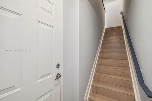 a kitchen with stainless steel appliances granite countertop a stove and a microwave